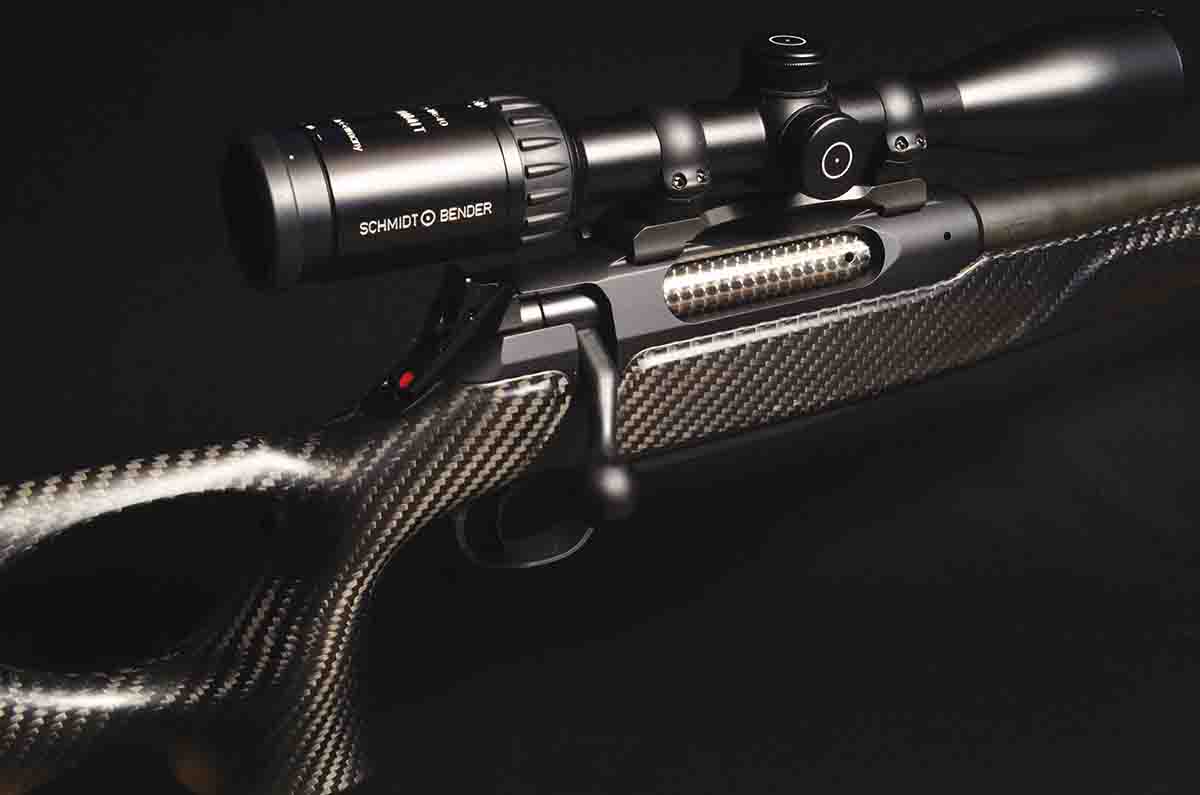 The 404 with the black carbon fiber stock is one of the most photogenic rifles ever seen. The scope is a Schmidt & Bender Summit LM (1-inch) 2.7-10x 40mm.